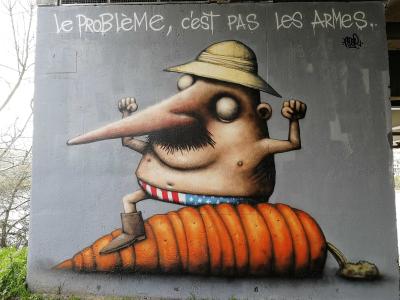 The Problem Is Not the Guns — Street art by Ador in Nantes