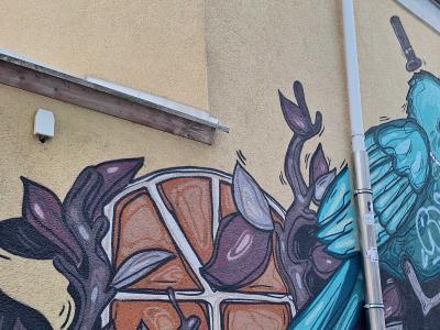 Blue and purple skull with flowers — Street art in Innere Stadt