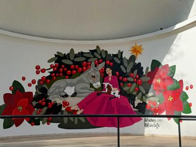 Femme à l'âne et fleurs de Noël — Street art de Rafi die Erste à Porto