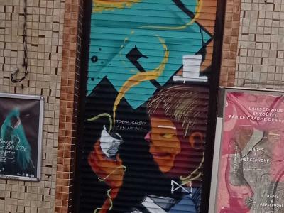 Abstract Silhouette on Teal Shutter — Street art in Lille