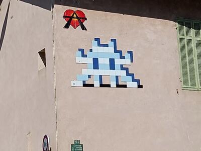 Large blue Invader at Roucas Blanc — Street art by Invader, A2 in Marseille