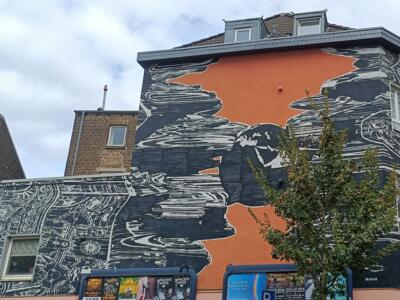 Globe terrestre et engrenages par M-City — Street art de M-CITY à Köln