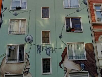 Neighbours, the two neighbours by Debug Visuals — Street art by Debug Visuals in Köln
