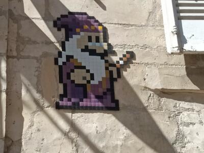 The wizard with the starred hat — Street art by IN THE WOUP in Bourges