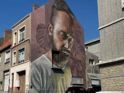 Bearded Portrait among Monstera Leaves — Street art by Smug in Boulogne-sur-Mer