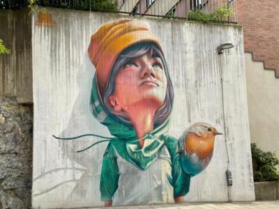 Girl with a robin by Yash — Street art by Yash in Stockholm