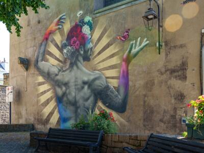 MrDheo's Man with Flowers — Street art by MrDheo in Saint-Brieuc