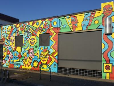 Masques et serpents d'Alberta Street — Street art de Tom Cramer à Portland