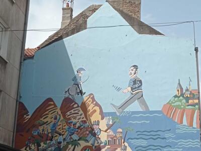 The Walker and the Cyclist above the Town — Street art in Boulogne-sur-Mer