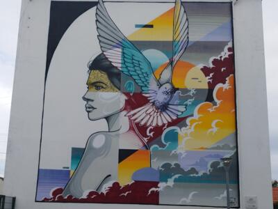 Le profil et la colombe aux nuages — Street art de Norione à Gargenville