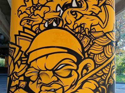 Warrior and Monster Yellow Silhouette — Street art in Rīga