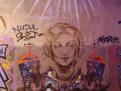 Art Deco Aviatrix with Tribal Masks — Street art in Paris
