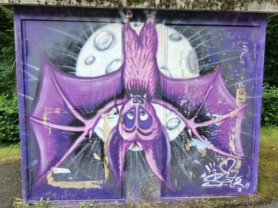 Cartoon Bat on Utility Box — Street art in Saint-Nectaire
