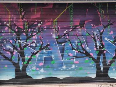 Black Trees with Colorful Flowers Digital Rain Mural — Street art in Grenoble