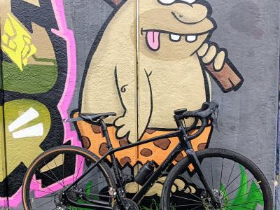 Cartoon Prehistoric Man in Mons — Street art in Mons