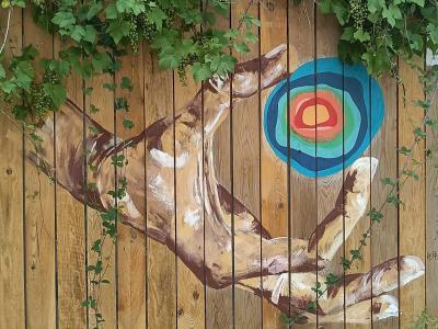 Hand Aiming at the Target — Street art in Janzé