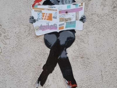 Woman Reading a Collage Newspaper — Street art in Vichy
