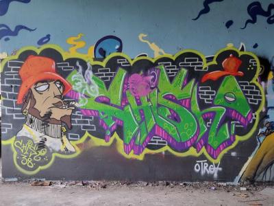 The smoker in an orange bucket hat — Street art in Grenoble