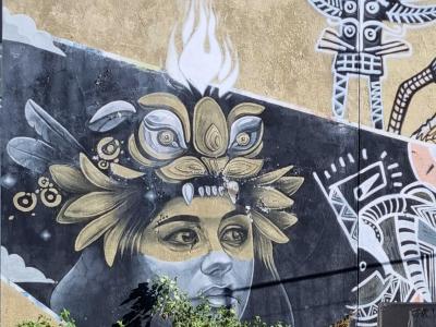 Character with Floral Crown and Flame — Street art in Clermont-Ferrand