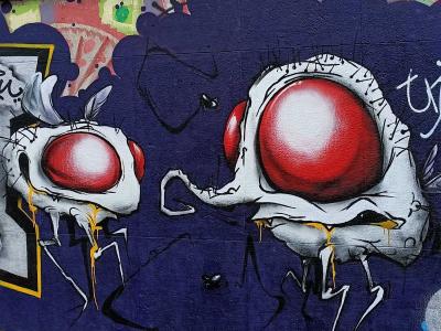 Red-Eyed Skulls on the Quays — Street art in Paris