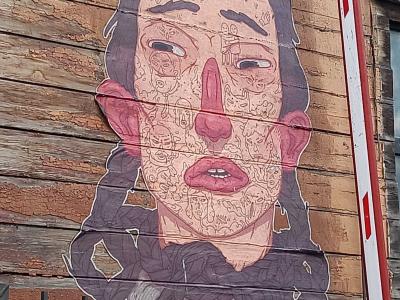 Tattooed Portrait on Wooden Facade — Street art in Rīga