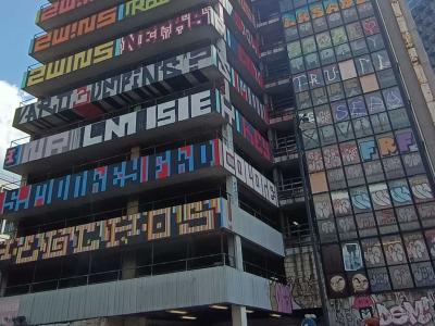 Building with Tiered Multicolored Letters — Street art in London