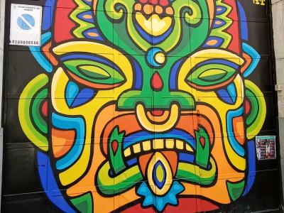 Vibrant Aztec Mask — Street art in Madrid