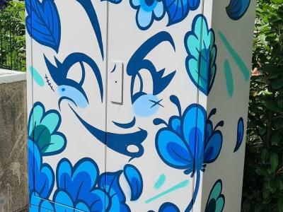 Flowered Cabinet with Eyes Hidden in the Blue — Street art in Strasbourg