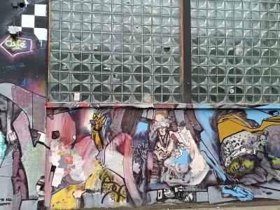 Surrealist Composition with Multiple Figures — Street art in Berlin
