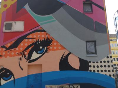 Pop-Art Woman Portrait with Colorful Hat — Street art by Sen2 in Saarbrücken