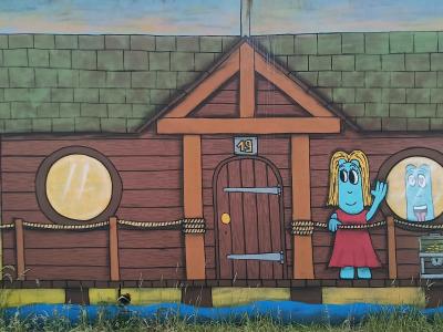 House with Blue Characters — Street art by Les Oides in Saint-Nazaire