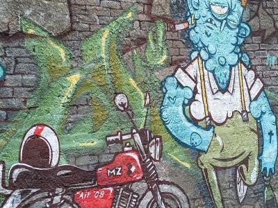 Blue Monster with a Motorcycle — Street art in Berlin