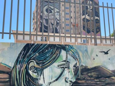 Enjoying the coast — Street art by Alice Pasquini in Málaga
