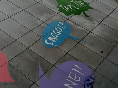 Insults in Speech Bubbles on Rue de la Chaufferette — Street art by Fotini Tikkou in Bruxelles