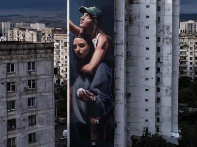 Changing the Light Bulb — Street art by Slim Safont in Tbilisi