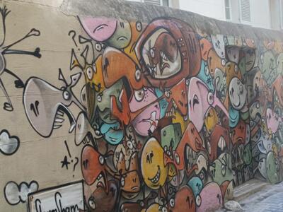 Slender Creatures on a Panier Wall — Street art in Marseille