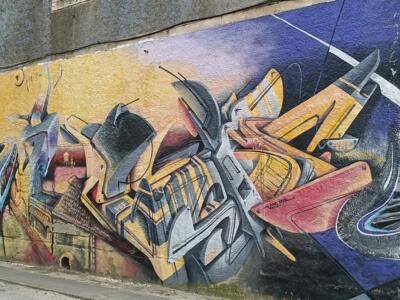 Lisbon Tram and Yellow Lettering by Vespa — Street art by Vespa in Almada
