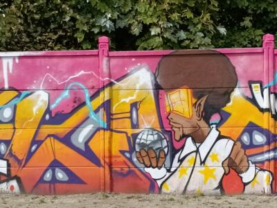 Man with an Afro Holding a Disco Ball — Street art in Reims