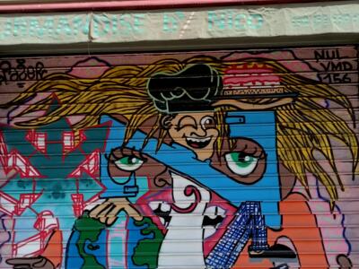 Burger-capped runner on a bakery shutter — Street art in Marseille