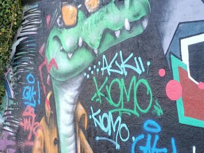 Green Crocodile by Komo — Street art in Lisboa