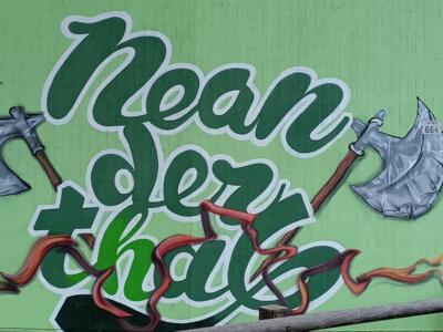 Neanderthal lettering with stone axes — Street art in Erkrath