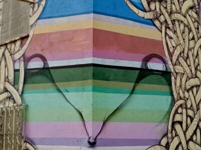 Rainbow Face Wrapping the Wall Corner — Street art in Lisboa