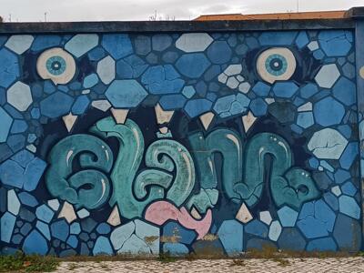 Monster made of blue stones — Street art in Lisboa