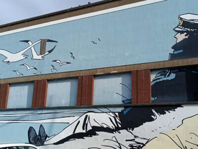Corto Maltese facing the gulls — Street art by Hugo Pratt in Bruxelles