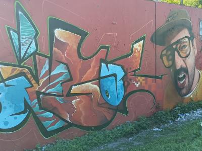 The Team Fire Cap Man — Street art by Demut in Berlin