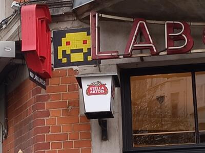 Yellow Space Invader at Au Laboureur — Street art by Invader in Bruxelles