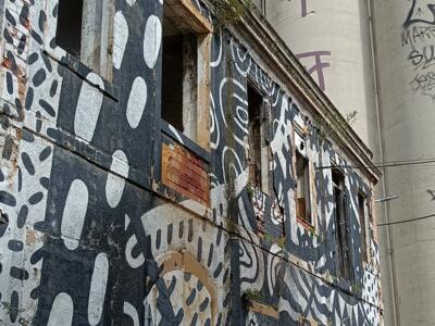 Black and White Patterned Facade with Silos — Street art by The Super Van in Almada
