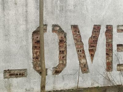 Love Carved into the Brick — Street art by Vhils in Lisboa