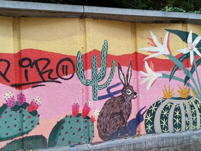 Desert with cacti and a hare — Street art by Rocío Álvarez in Ixelles