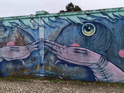 Two faces with hands over their mouths — Street art in Lisboa